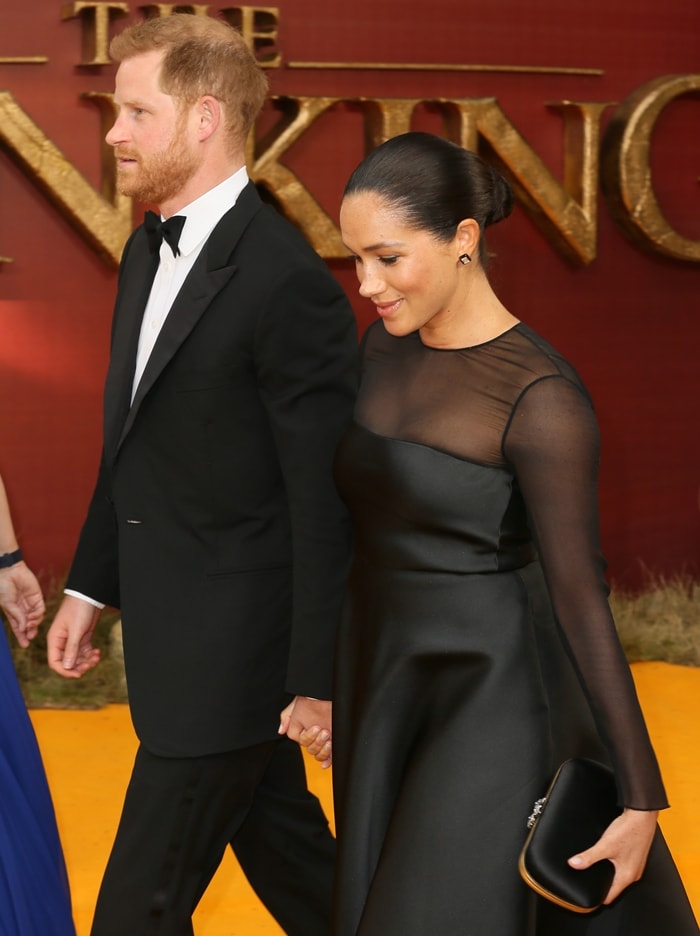 Meghan Markle donned an ill-fitting black mesh panel flared dress from Jason Wu