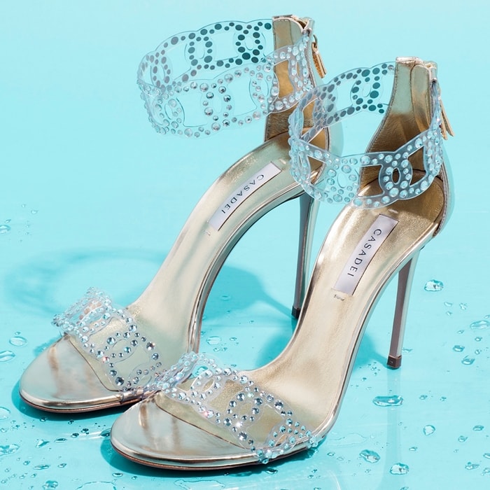 Expertly crafted in Italy from silver-toned leather, these Sirene sandals from Casadei are embellished with crystal applications, meant to resemble tiny water drops on the foot’s skin