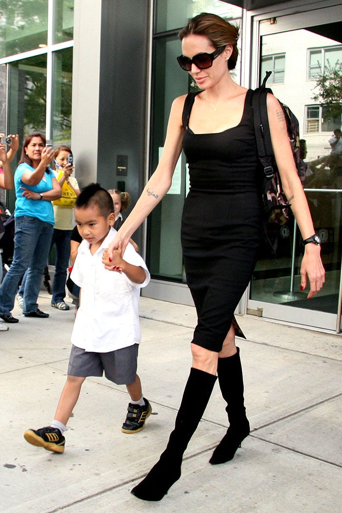 Angelina Jolie picking up Maddox from school in black boots