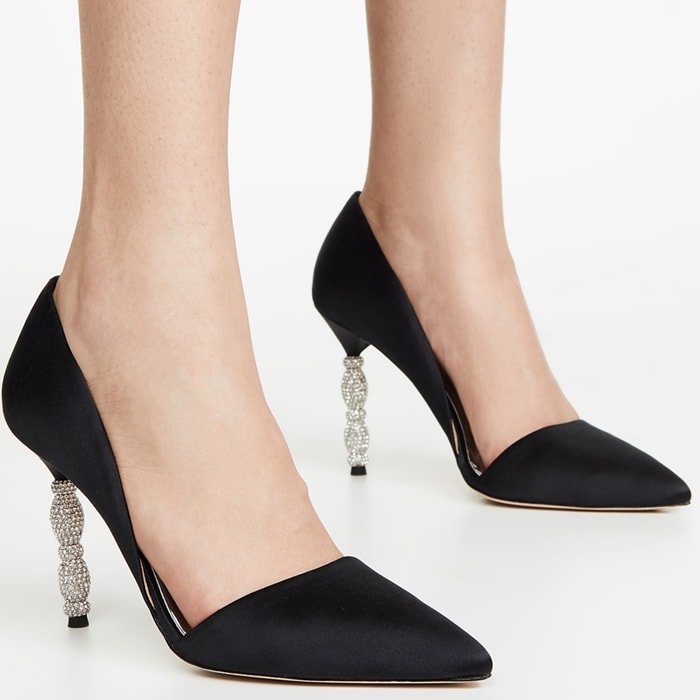 A sculptural heel featuring stacked geometric forms set with tiny pavé crystals simply dazzles on a black pointy-toe pump with a sophisticated d'Orsay silhouette