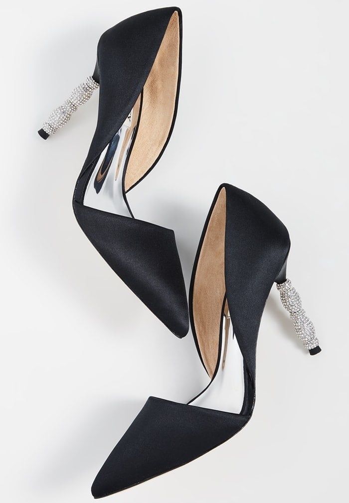 A sculptural heel featuring stacked geometric forms set with tiny pavé crystals simply dazzles on a black pointy-toe pump with a sophisticated d'Orsay silhouette