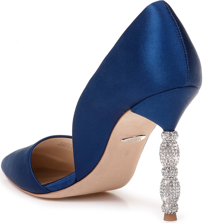 A sculptural heel featuring stacked geometric forms set with tiny pavé crystals simply dazzles on a navy pointy-toe pump with a sophisticated d'Orsay silhouette