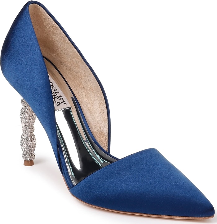 A sculptural heel featuring stacked geometric forms set with tiny pavé crystals simply dazzles on a navy pointy-toe pump with a sophisticated d'Orsay silhouette