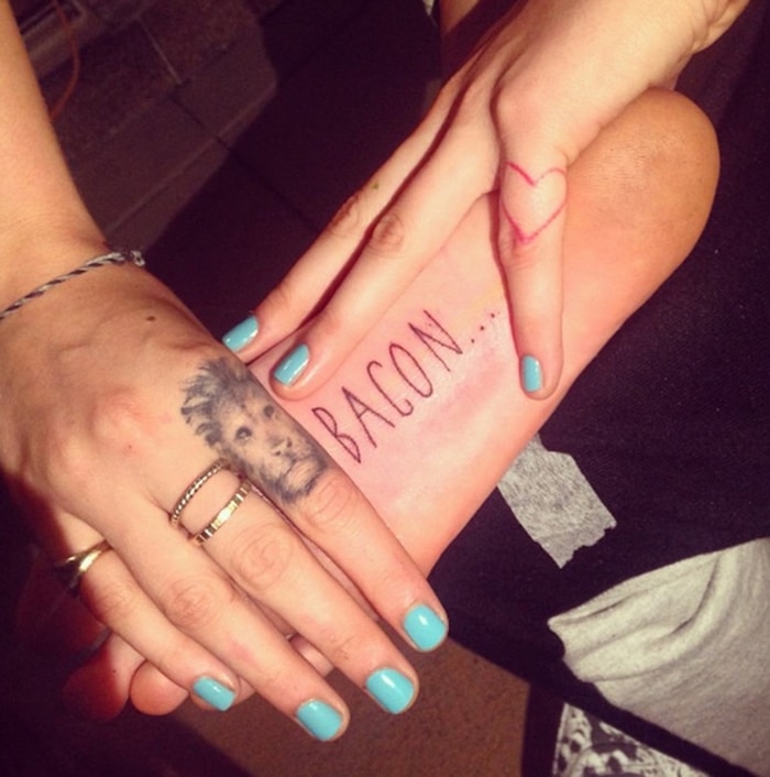 Cara Delevingne has "Bacon..." tattooed on the sole of her right foot