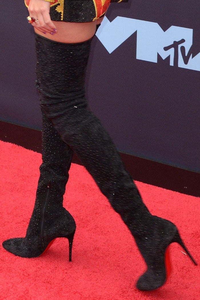 Taylor Swift's legs in Christian Louboutin 'Elouix' stretch thigh-high boots studded with black crystals
