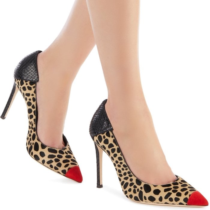 These high-heel, animal print natural pony pumps are characterized by the cocktail red suede patent insert on the front, and by the black alligator print leather insert on the back