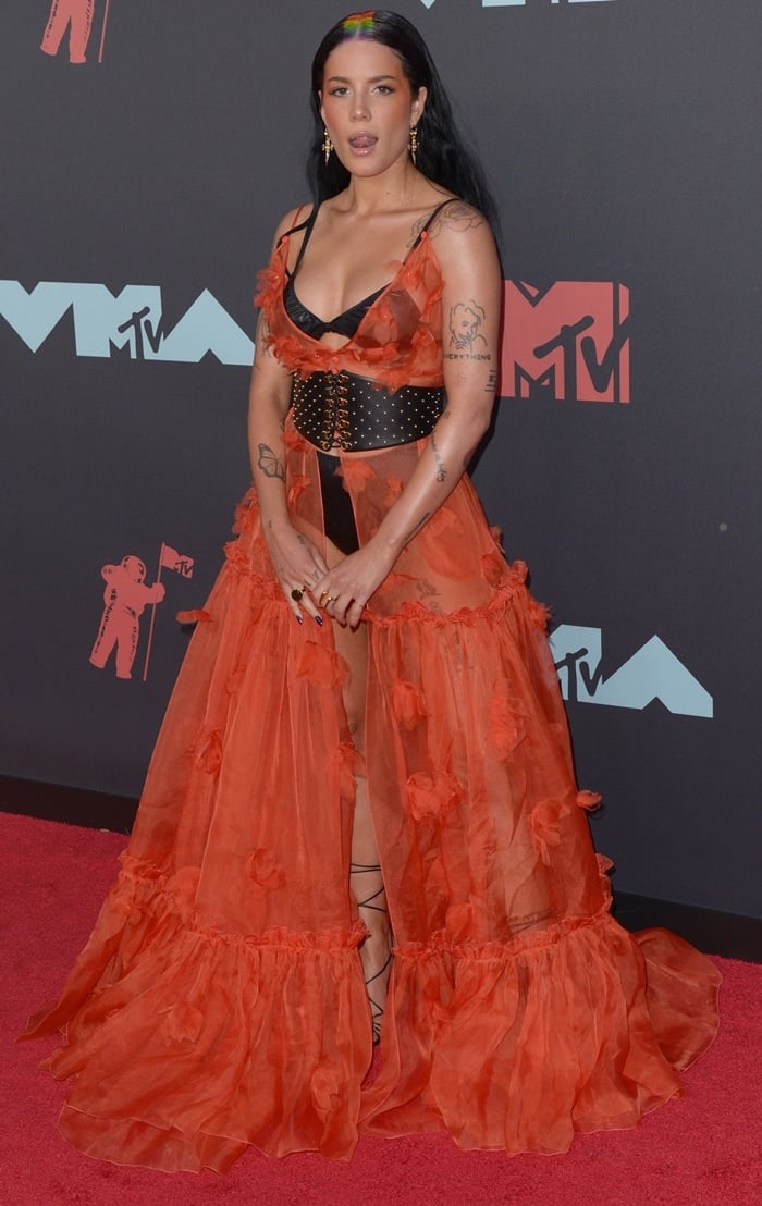 The "kind of naked" Halsey plays with her tongue at the 2019 MTV VMAs