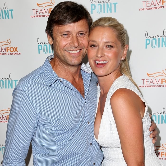 Katherine LaNasa looks effortlessly chic in a white textured dress while posing with her husband, Grant Show, at the Raising The Bar To End Parkinson's event