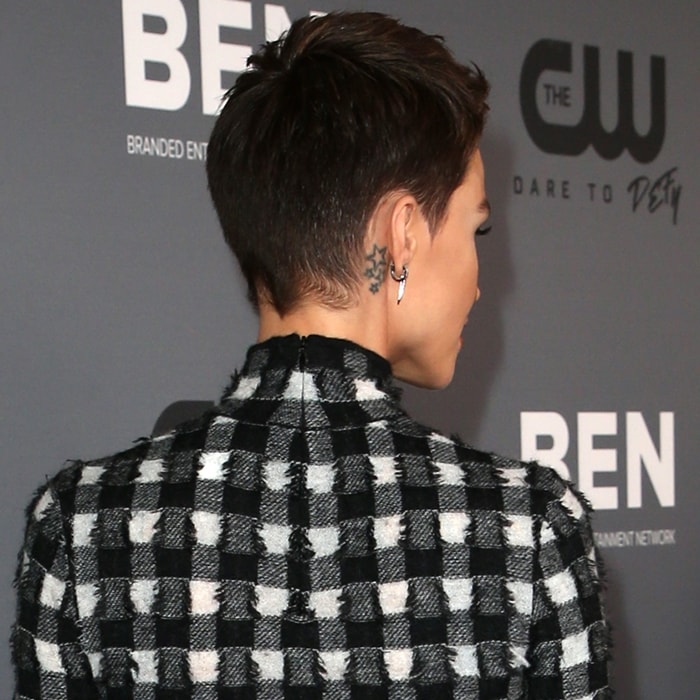 Ruby Rose has a cluster of four stars inked behind her right ear