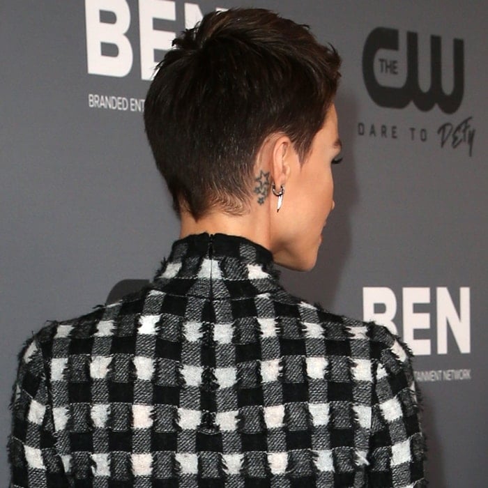 Close-up of Ruby Rose's four star tattoos, a subtle nod to her unique style, behind her right ear