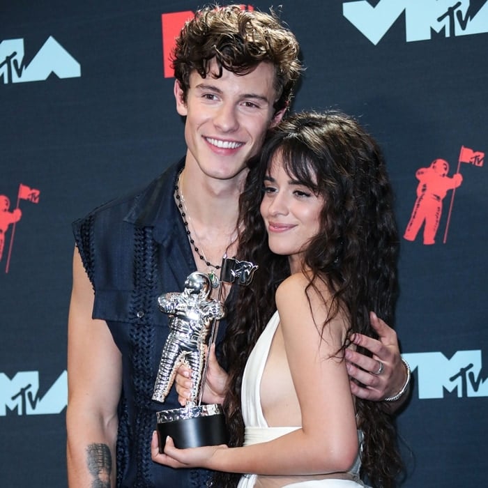 Singer Shawn Mendes celebrating with his girlfriend/singer Camila Cabello