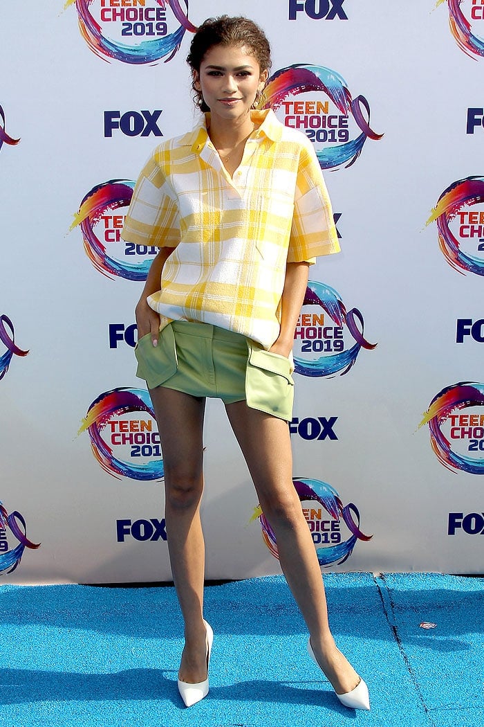 Zendaya in a Jacquemus Spring 2020 yellow plaid shirt and avocado green shorts at the 2019 Teen Choice Awards in Los Angeles