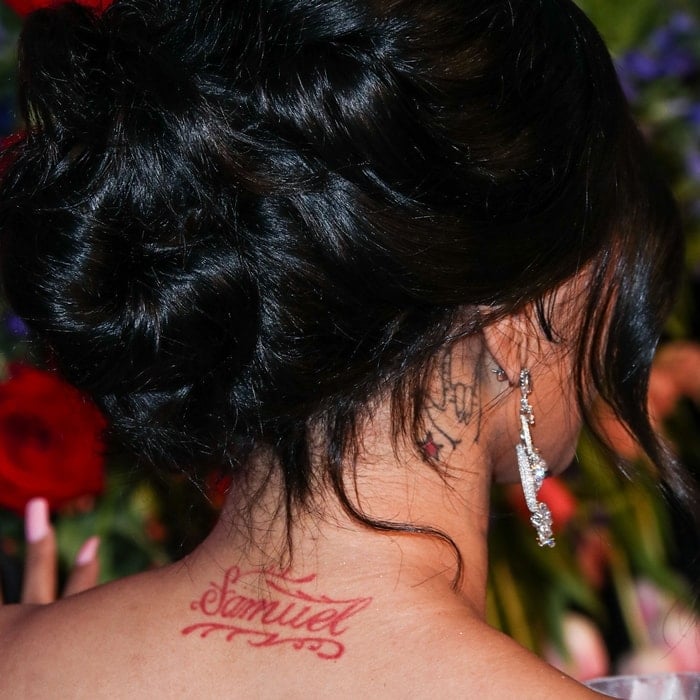 Cardi B has a tattoo of the ASL sign for "love" on the left side of her neck and a tattoo of the name "Samuel" on the right side of her neck in honor of her late father