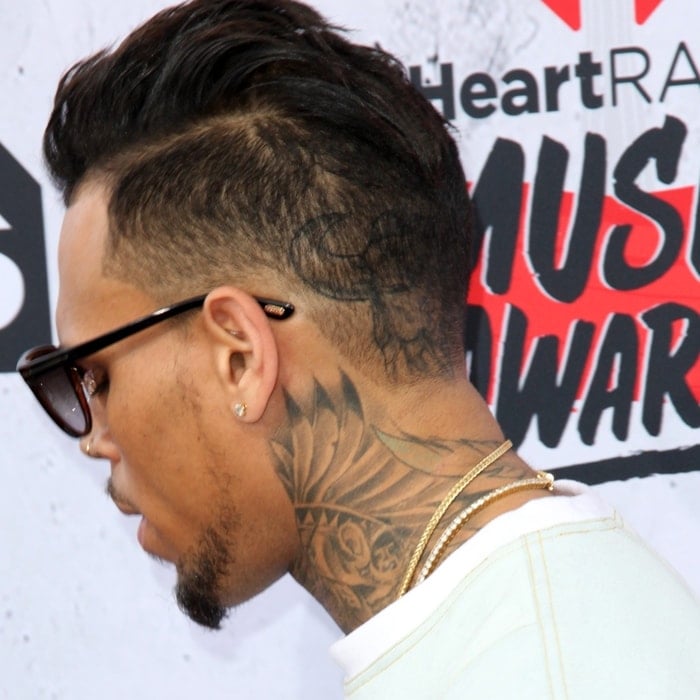 Chris Brown's neck tattoo of an Indian chief transforming into a wolf