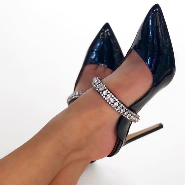 A strap glinting with crystals adds event-ready glamour to a leather Duke mule with a pointy toe, curvy topline and slim stiletto heel