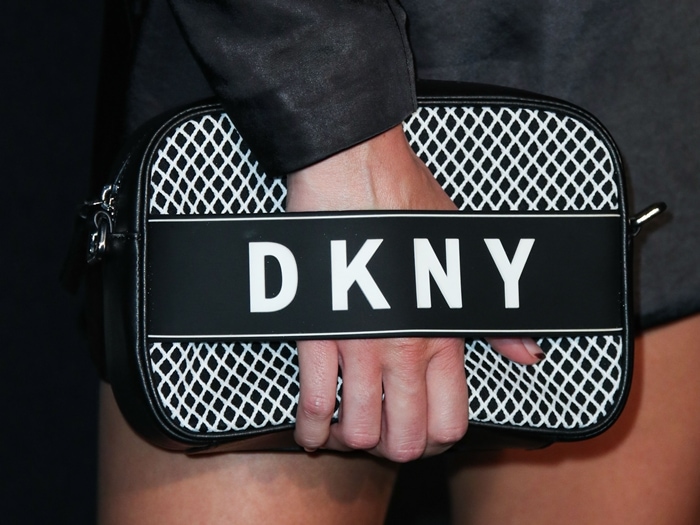 Kendall Jenner wearing a practical yet punchy compact camera bag