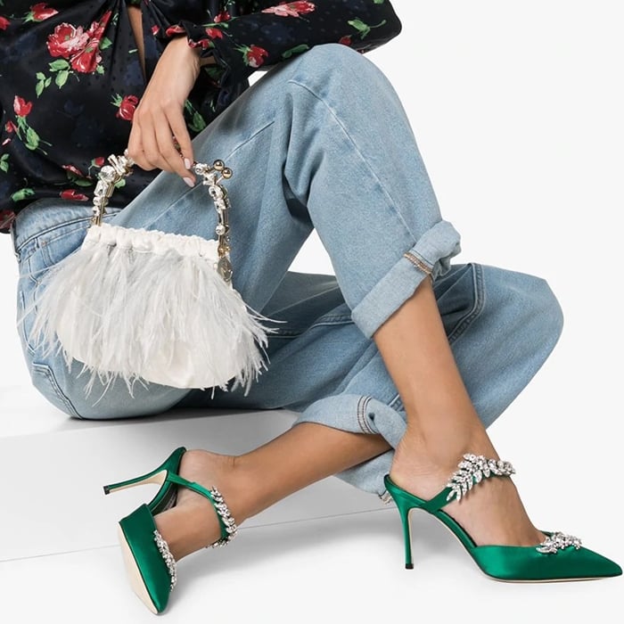 Sparkling crystal leaves vine across the strap and vamp of this pointy-toe pump, demonstrating Manolo Blahnik's flair for dramatic embellishment