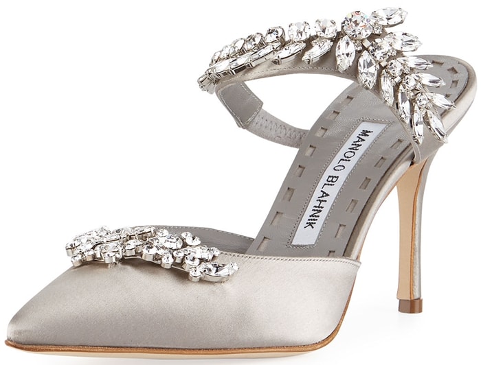 Sparkling crystal leaves vine across the strap and vamp of this pointy-toe pump, demonstrating Manolo Blahnik's flair for dramatic embellishment