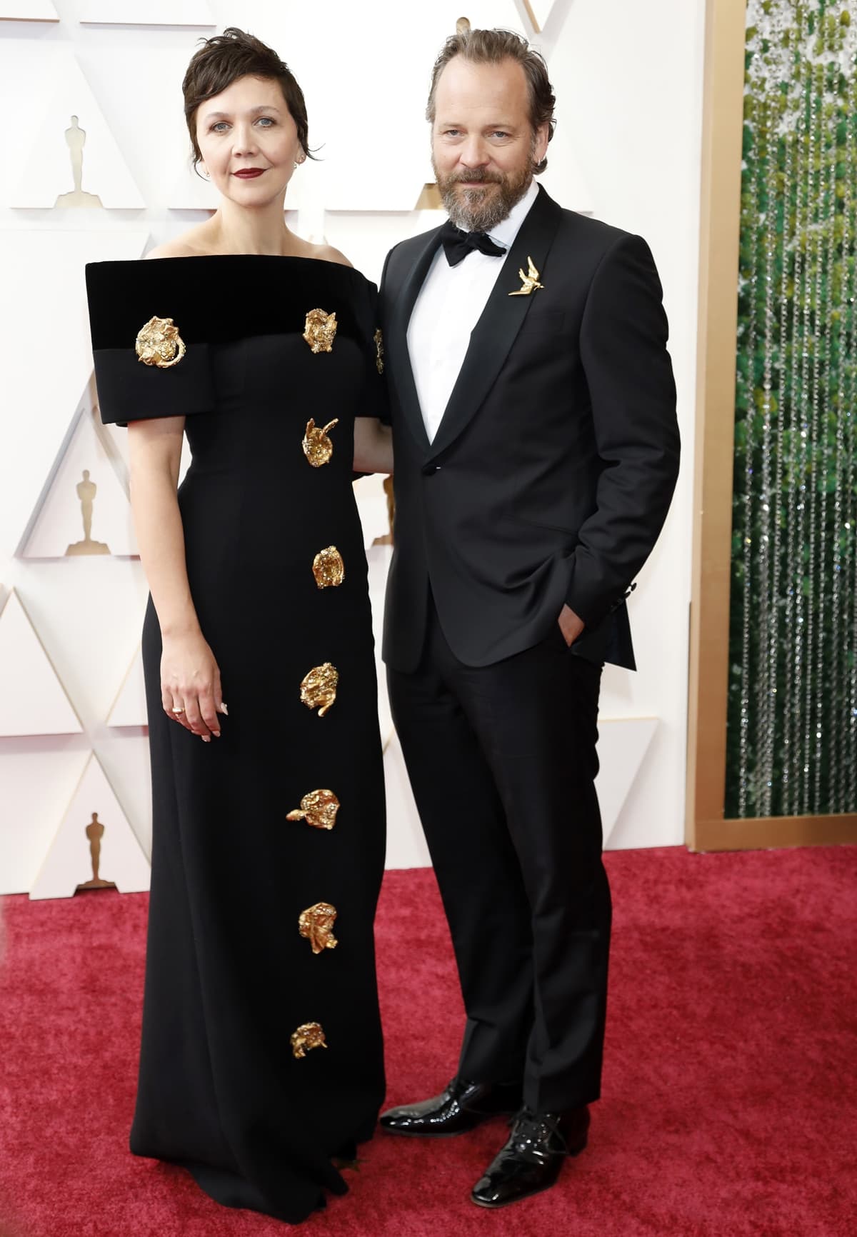 Peter Sarsgaard and Maggie Gyllenhaal in a Schiaparelli dress and Grace Lee jewelry at the 94th Annual Academy Awards