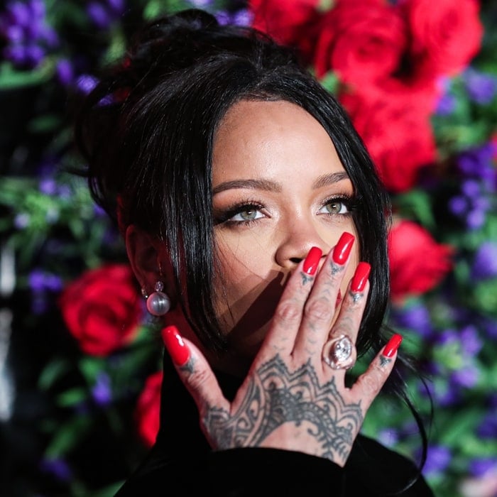 Rihanna shows off her finger and hand tattoos