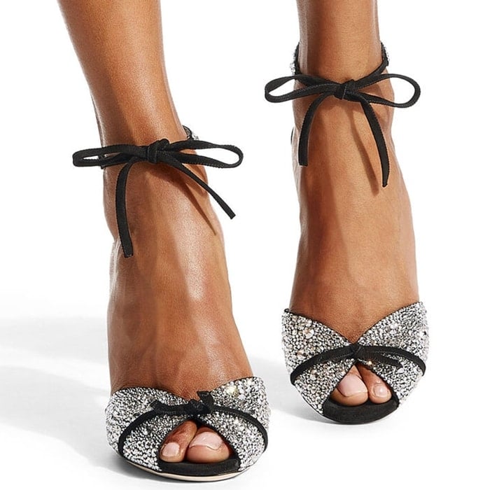 Dazzling jewelled embellishment and delicate velvet bows add red-carpet glamour to these peep-toe leather sandals