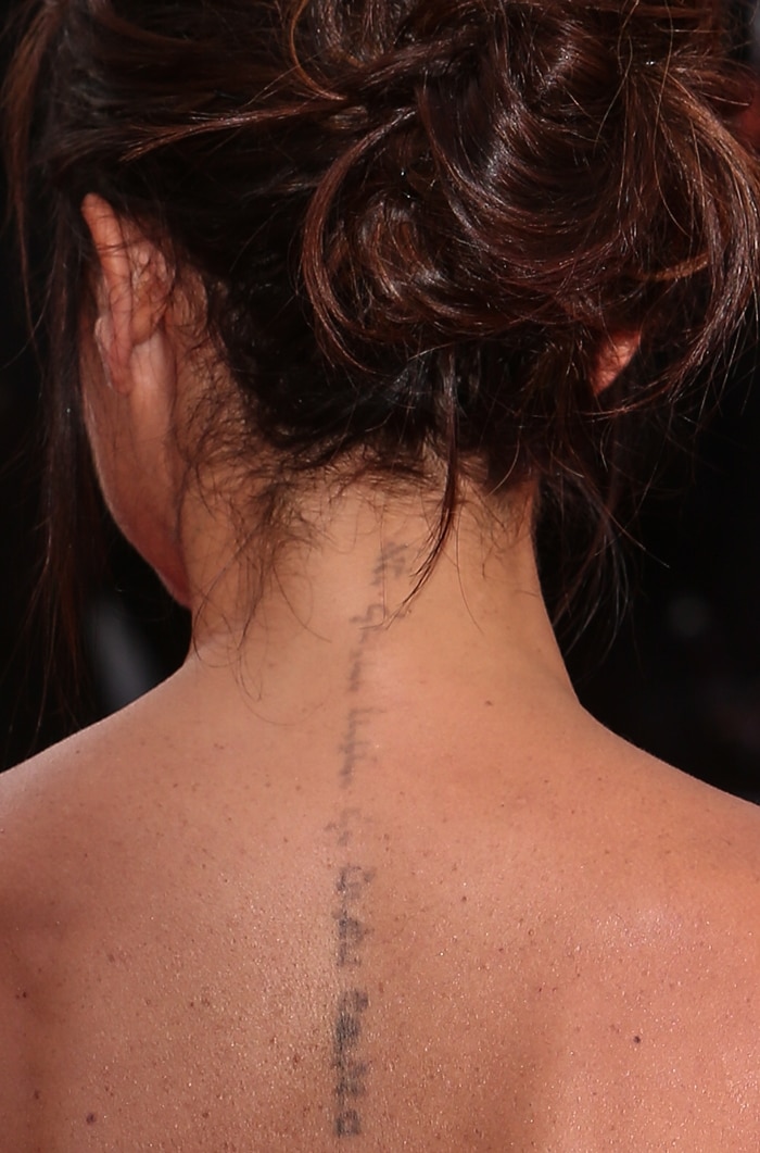 Victoria Beckham's wedding anniversary tattoo going down her spine