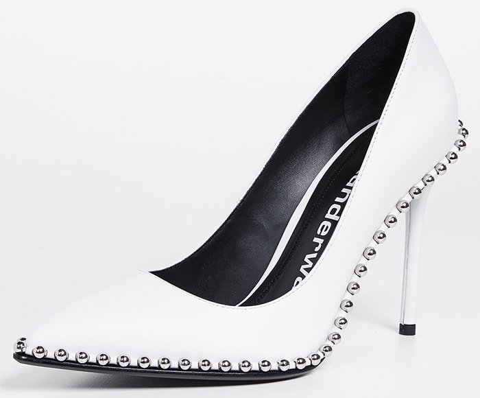 Silvery ball studs—an edgy detail seen in Alexander Wang's ready-to-wear collections—highlight the sharply pointed toe of this ultra-versatile stiletto