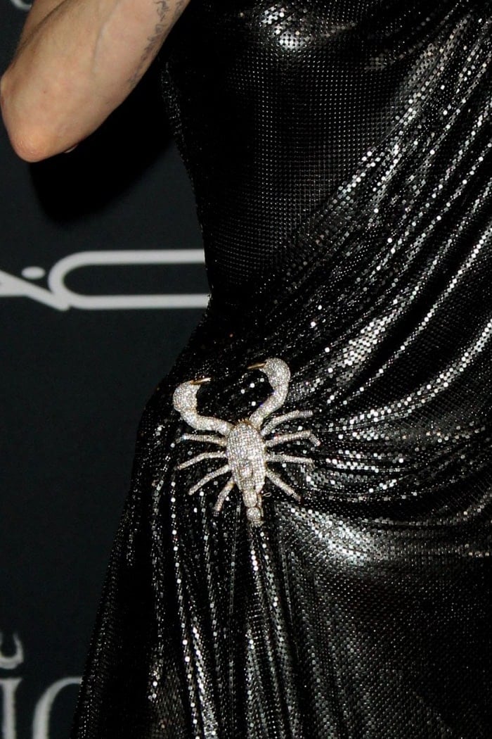 Scorpion brooch on Angelina Jolie's Versace chainmail gown