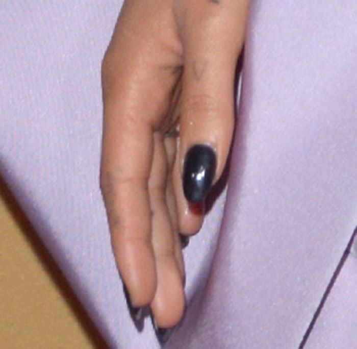 Ariana Grande's faded letter "A" tattoo on her thumb