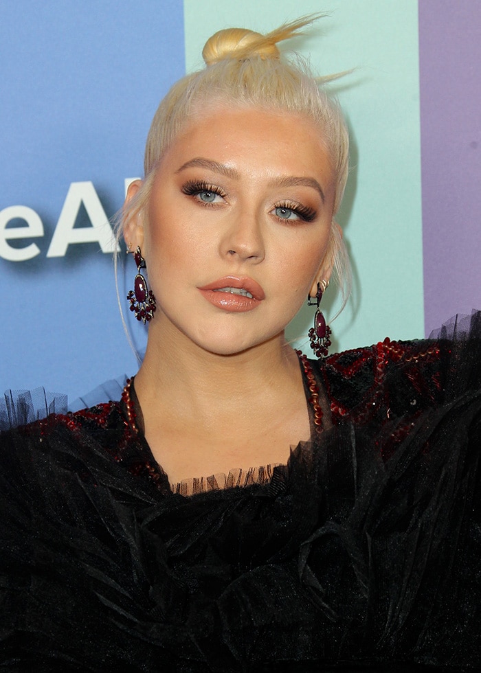 Christina Aguilera looks like a glam diva in sequined Nicolas Jerban jumpsuit and tulle cape 