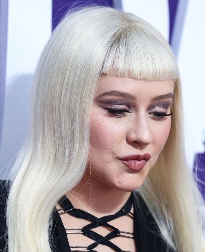 Singer Christina Aguilera's fuller cheeks are attributed to overfilled facial fillers