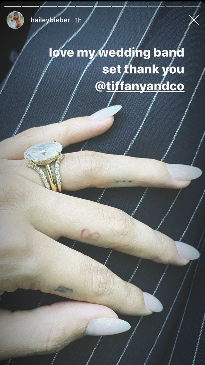 Hailey Bieber shows off her wedding ring on her tattooed finger
