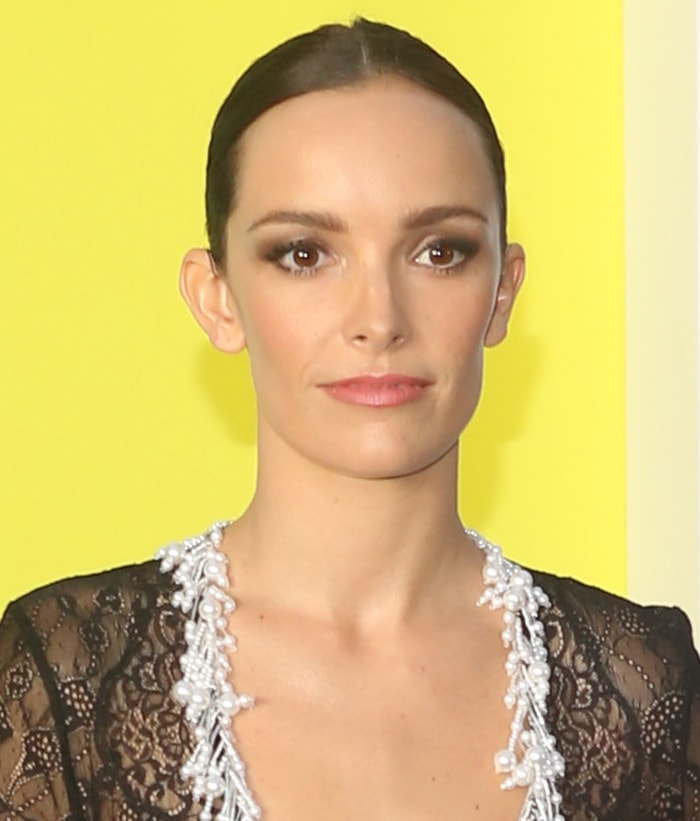 Jodi Balfour wears center-parted bun and pink lipstick