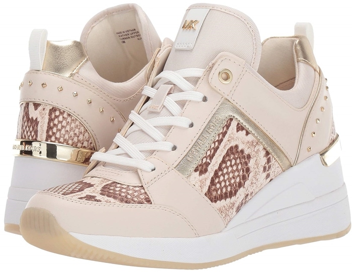 Mixed-media construction, metallic accents and a wedge heel add undeniable glamour to this sporty, street-chic sneaker