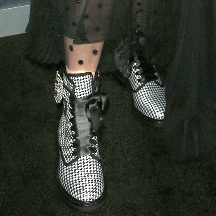 Roger Vivier buckled houndstooth-print boots on Maisie Williams