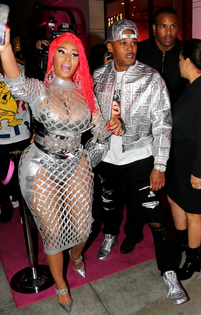 Nicki Minaj styled her metallic fishnet dress with a statement belt