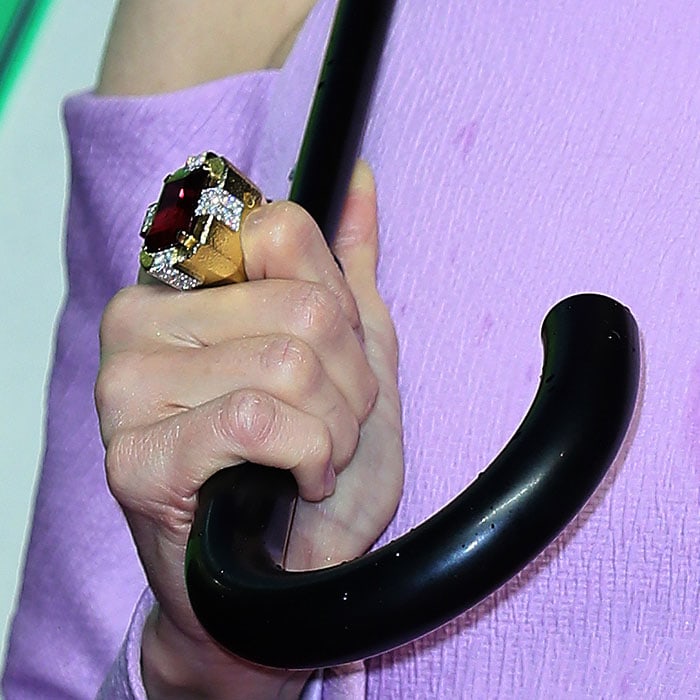 Renee Zellweger wearing a David Webb square ruby ring