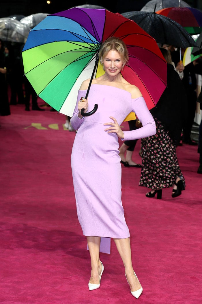 Renee Zellweger in a lilac off-shoulder dress and white Christian Louboutin pumps