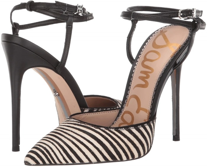 A fiercely stylish pump with a pointy toe and slim ankle strap that criss-crosses at the back is finished with a logo buckle and willowy stiletto heel