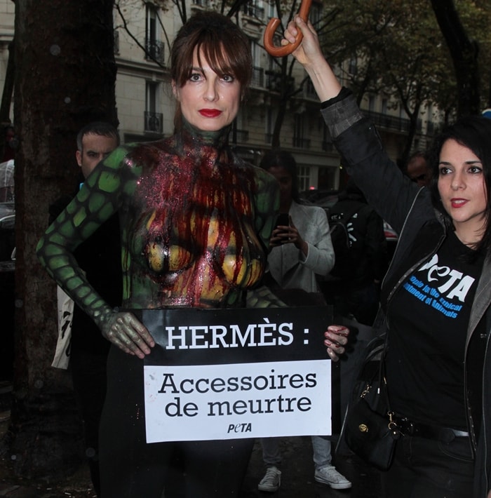 Animal rights organization Peta and German actress Alexandra Kamp protesting against the use of crocodile skin outside the Hermes fashion show in Paris, France