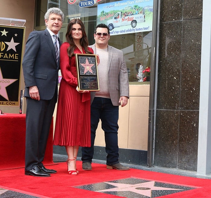 The Walt Disney Studios’ co-chairman and chief creative officer Alan Horn and actor Josh Gad honor Idina Menzel