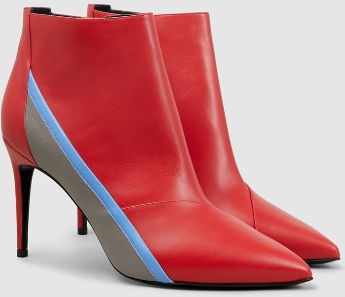 Fashioned with a pointed toe and spliced with an electric racing stripe, this red leather ankle boot has been crafted in Italy from smooth cherry-red leather, designed with a stiletto heel and inner zip fastening