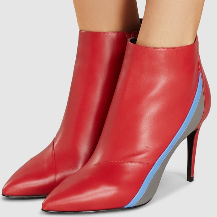 Fashioned with a pointed toe and spliced with an electric racing stripe, this red leather ankle boot has been crafted in Italy from smooth cherry-red leather, designed with a stiletto heel and inner zip fastening