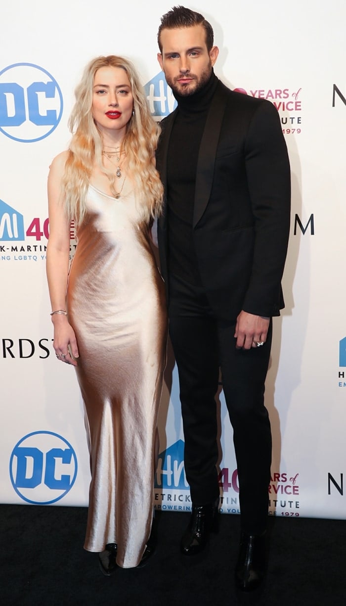 Amber Heard and Nico Tortorella pose together on the carpet while stepping out for the 2019 Emery Awards