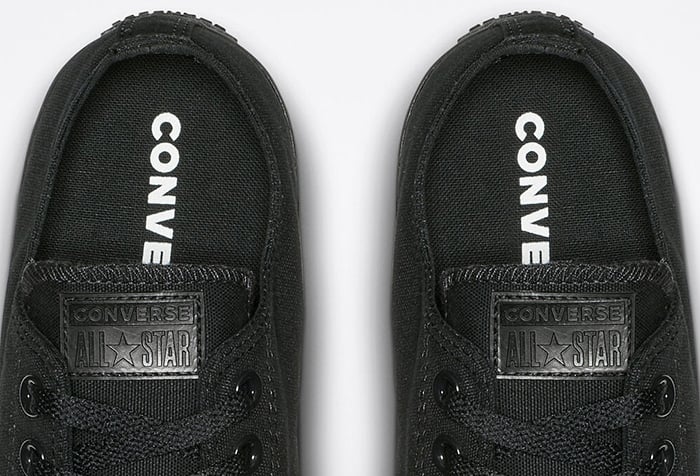 The inner soles of black Converse All Star shoes