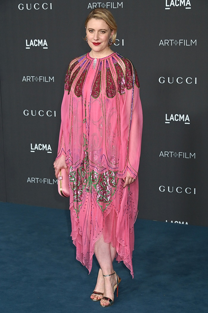 Greta Gerwig wears a Gucci pink silk layered dress