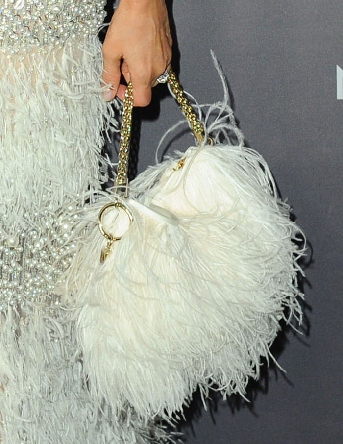 Jessica Alba carries a Jimmy Choo feather bag