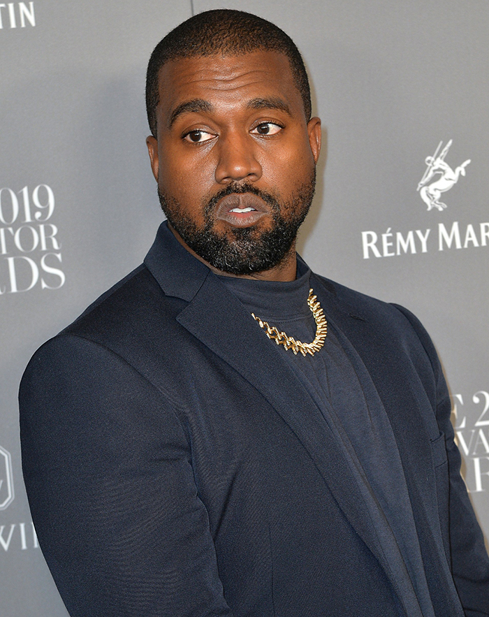 Kanye West matches Kim Kardashian's outfit with midnight blue suit