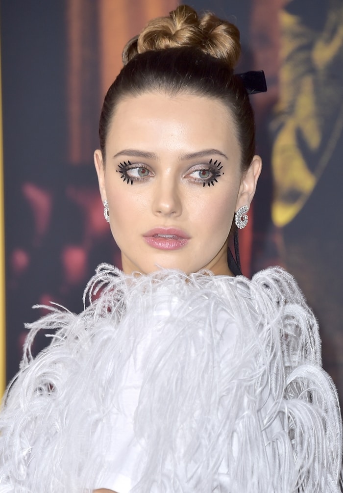 Katherine Langford's dramatic eyelashes by makeup artist Fiona Stiles and earrings from Chopard's Precious Lace Collection