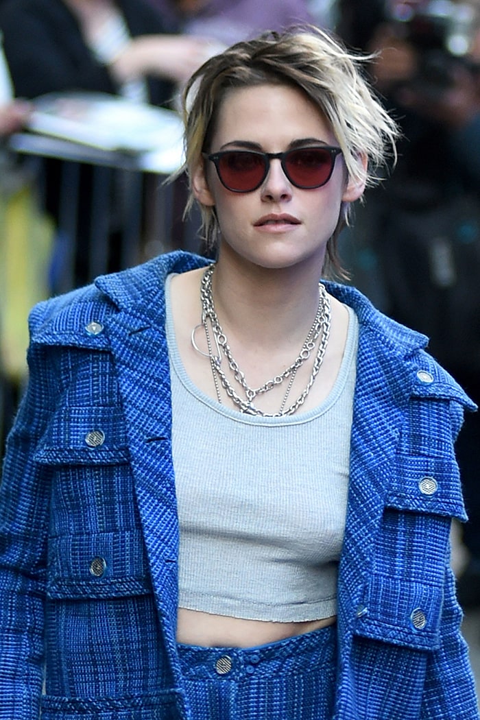 Kristen Stewart goes braless underneath her tank top and blazer